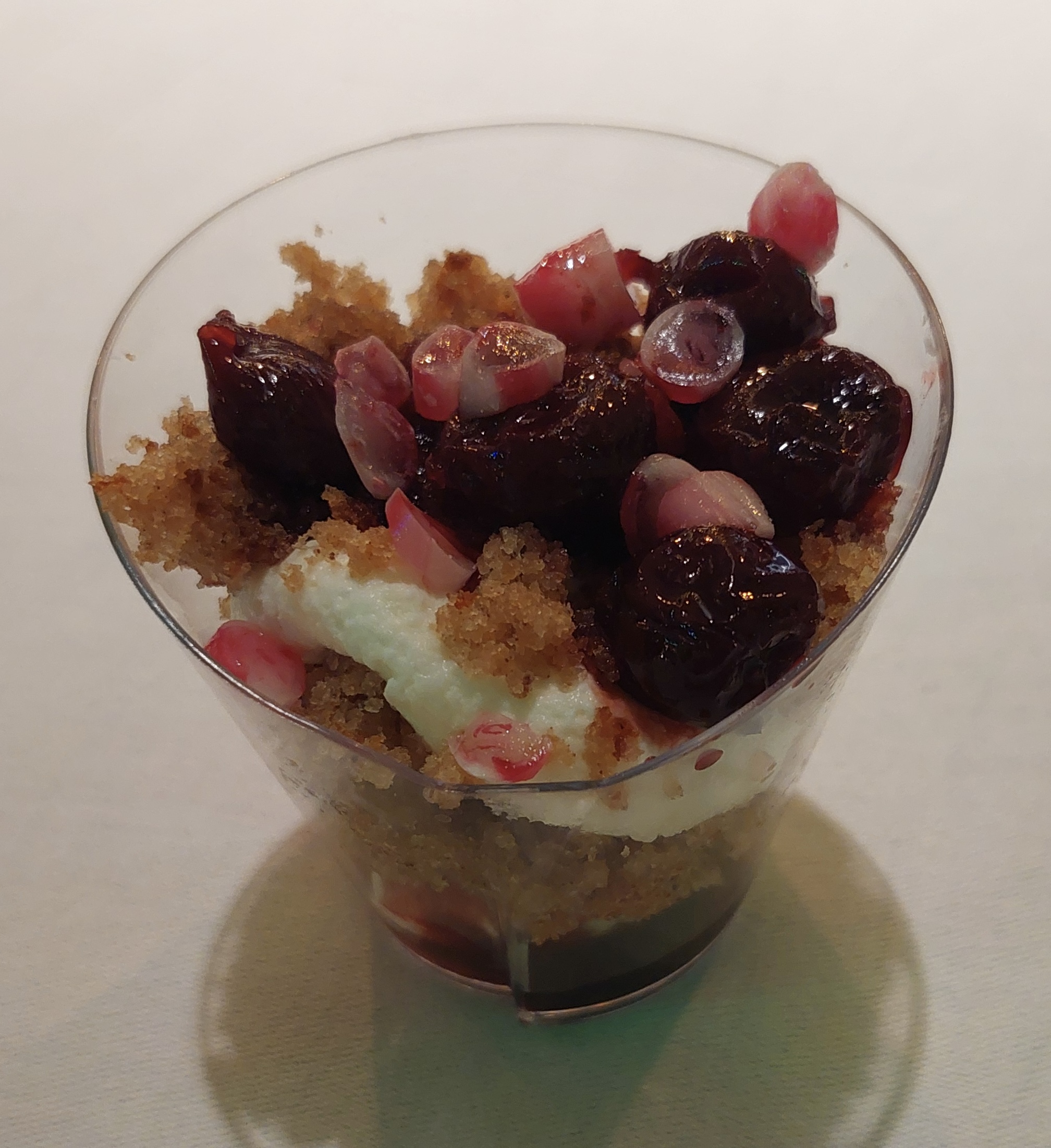 Gingerbread sponge cake with cherries in a jar.