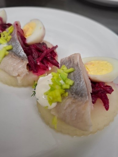 Herring with apple, quail egg and beetroot