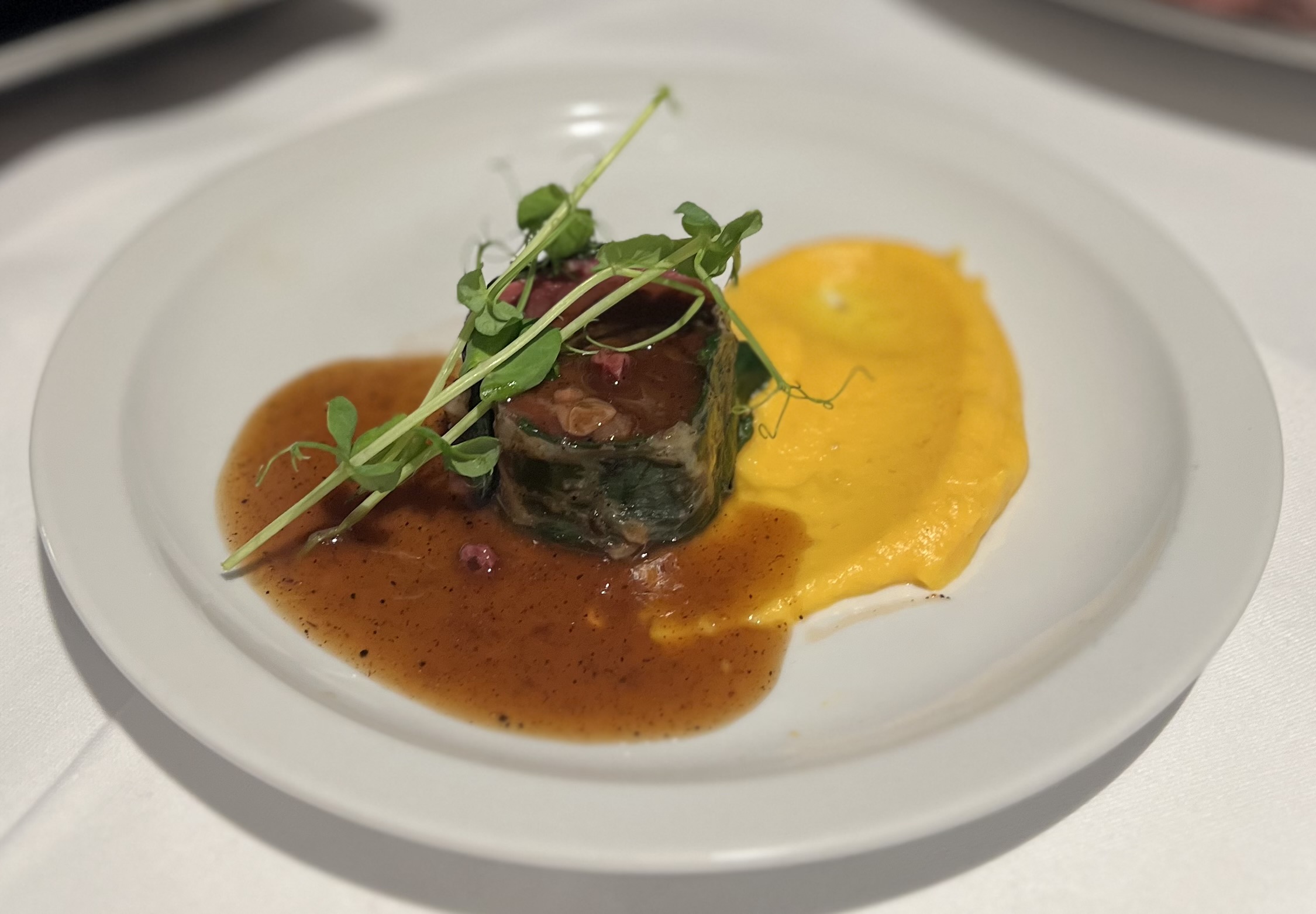 Fillet of hare with duxelles of mushroom and truffle, sauce with cranberries, pumpkin muslin