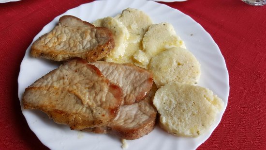 Ombolo (boneless pork loin) giravolta with polenta